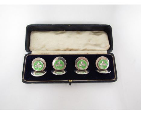A set of four Sampson Mordan &amp; Co Ltd silver menu/place name holders with green enamel guilloche roundels with shamrock m
