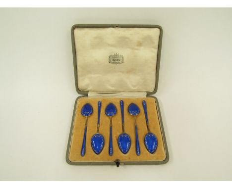 A set of six 925 silver gilt and blue enamel coffee spoons in a Harrods retail case 