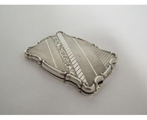 A Continental white metal powder compact with engine turned decoration and shaped edge, marks indistinct 