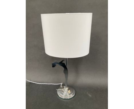 An Art Deco chrome table lamp with a figure of female nude, with shade 