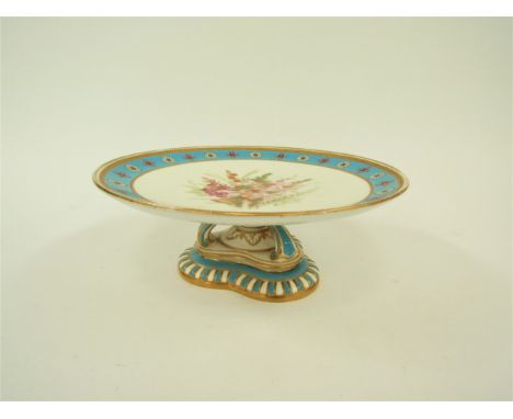A Royal Worcester comport with sky blue border, central floral spray on decorative pedestal, 9cm tall x 23.5cm diameter 