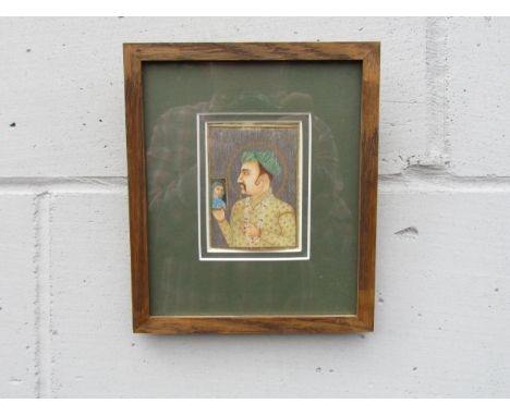 A 19th Century Mughal portrait of a dignitary, painted on an ivory panel. (Cracked from top to bottom on the left hand side) 