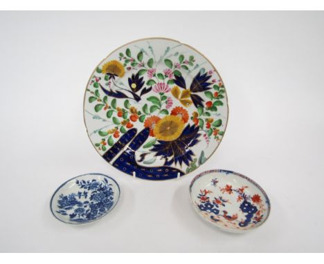 A late 18th Century Worcester blue and white dish with ‘Fence’ pattern, together with a Lowestoft tea bowl in the ‘Two Birds’