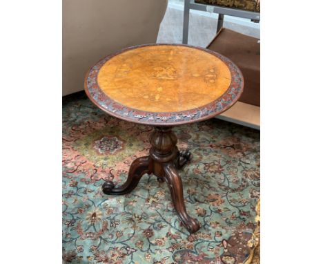 A Victorian walnut tripod wine table. marquetry inlaid design of horse and rider and foliage on burr surface, blind fret bord