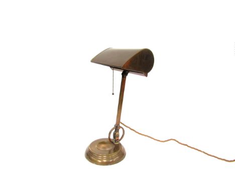 A brass desk lamp with pull chain, marked 