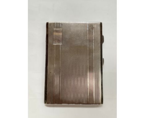 A silver engine turned cigarette case of rectangular form with vacant cartouche, 12.5cm x 8.5cm 
