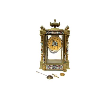 A circa 1900 French champleve brass mantel clock with Japy Freres movement, Arabic dial, architectural pillar and urn detail,