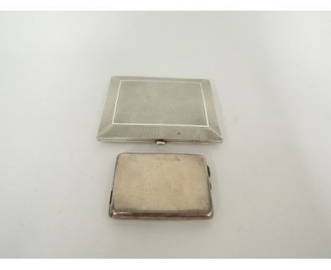 A silver engine turned cigarette case, Chester 1923, 9cm and a silver match box case, Birmingham, engraved Bryant &amp; May M