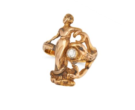 AN ART NOUVEAU DIAMOND SNAKE RING designed as a snake coiled around the figure of a woman, the snake holding an old cut diamo