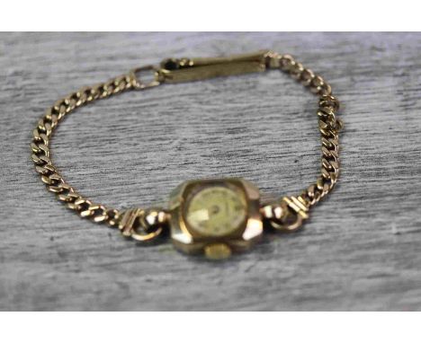 Marvin 9ct yellow gold ladies vintage wristwatch, champagne dial with gilt Arabic numerals and pencil hands, hexagonal case, 