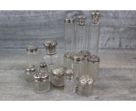 Collection of various silver topped cut glass dressing table jars and scent bottles, to include Victorian silver topped and c