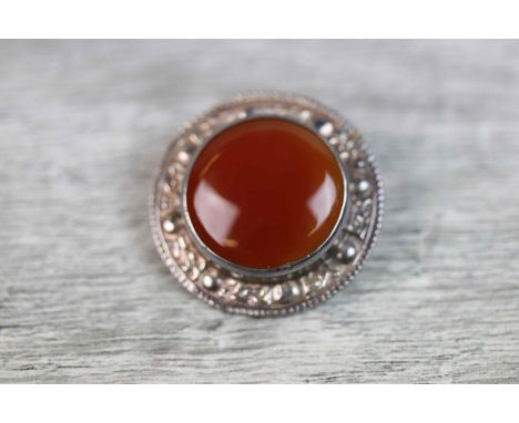 1960s Scottish carnelian silver target brooch, the circular cabochon cut collet set carnelian measuring approximately 10mm di