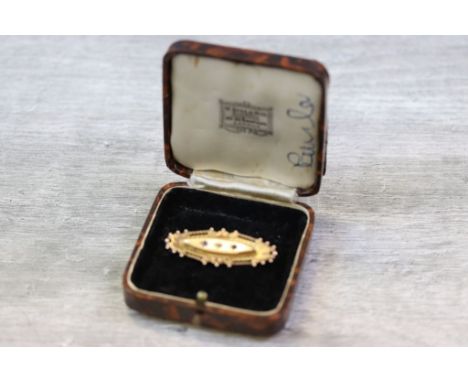 Edwardian diamond and sapphire 9ct rose gold brooch, the marquise shaped centre raised panel set with small rose cut diamond 