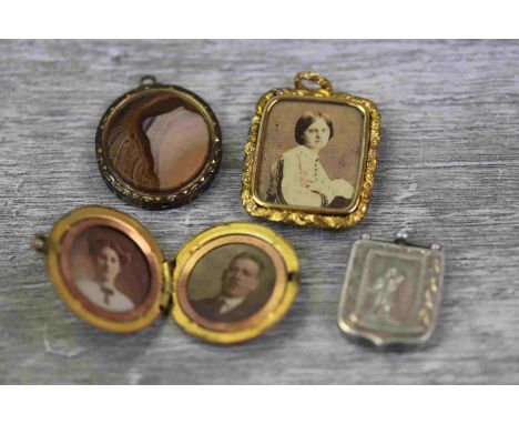 Collection of Victorian pendants to include yellow metal pendant, the central glazed panel containing a photograph of a Victo