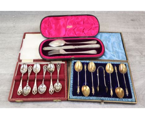 Cased Victorian silver Christening set comprising spoon, knife &amp; fork, engraved foliate scroll decoration allover, makers