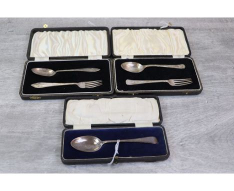 Three cased silver Christening sets comprising a George VI silver teaspoon and fork with arched decoration, makers William Su