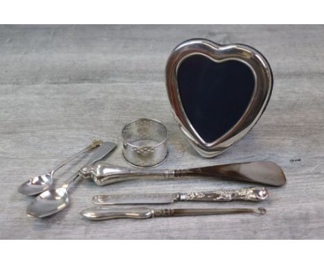 Silver heart shaped easel back photograph frame, makers Carr's of Sheffield, Sheffield 1986; a pierced silver napkin ring, ma