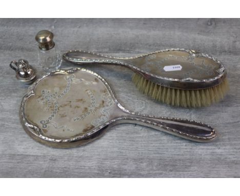 Early George V silver back dressing table brush and matching hand mirror, stylised floral pattern border surround, engraved g