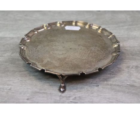 George V silver salver/ card tray, raised on three pointed feet, Chippendale border, makers Munsey &amp; Co, London 1927, dia
