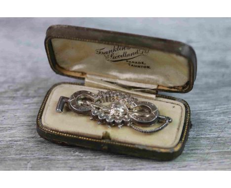 Victorian white metal brooch modelled as a riding crop with horseshoe and fox head motifs, the fox head to centre with small 