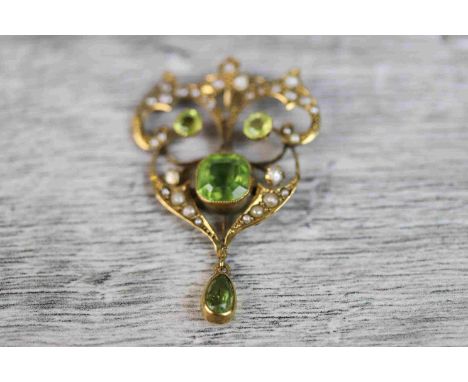 Late Victorian/ Edwardian peridot and seed pearl 9ct yellow gold pendant, the central octagonal mixed cut peridot measuring a