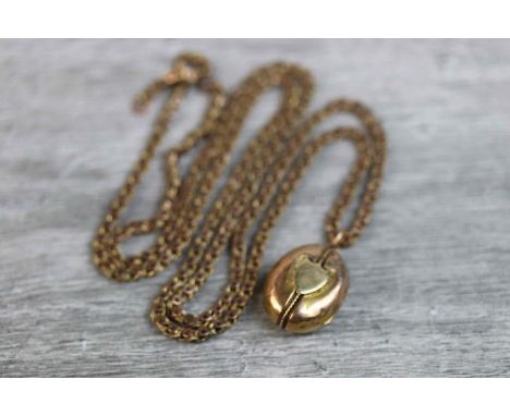 Victorian yellow metal oval locket pendant with blank shield cartouche to centre and rope twist design (missing one interior 