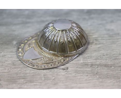 Novelty silver caddy spoon modelled as a jockey's cap, repousse garland style floral and star motifs, blank shield shaped car
