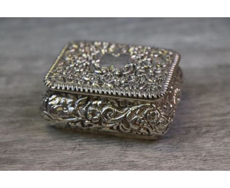 Late Victorian silver snuff box, the hinged lid and body with repousse floral scrolled decoration, monogrammed and dated cent