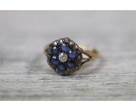 19th century diamond and sapphire yellow gold and silver set flower head cluster ring, the centre round old cut diamond weigh