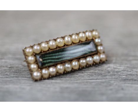 Late Victorian/ Edwardian seed pearl rose metal rectangular brooch, the rectangular central glazed compartment with seed pear