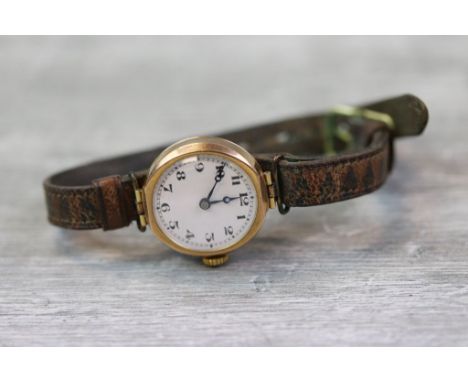 Vintage Ladies 9ct Gold wristwatch with enamel dial, vintage leather strap and a 15 jewel Swiss movement