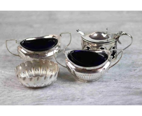 Pair of late Victorian twin handled silver boat shaped salts with later blue glass liners, gadrooning to lower half, makers M