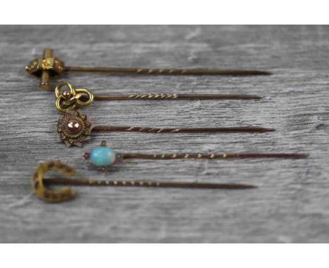 Five Victorian and Edwardian stick pins to include precious white opal and seed pearl rose metal stick pin, horseshoe 10ct go