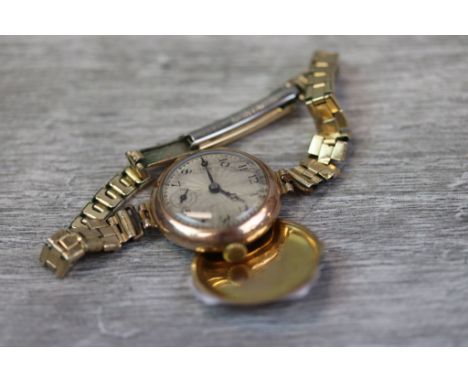 Ladies Vesta 15 jewels 9ct Gold wristwatch with Breguet hairspring &amp; cut balance, the engine turned metallic dial has sub