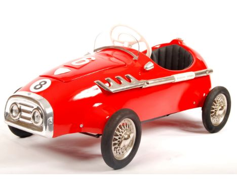 A rare original unused vintage 1960's Pines of Italy made child's pedal car. In red, with chrome exhaust, headlights, vinyl s