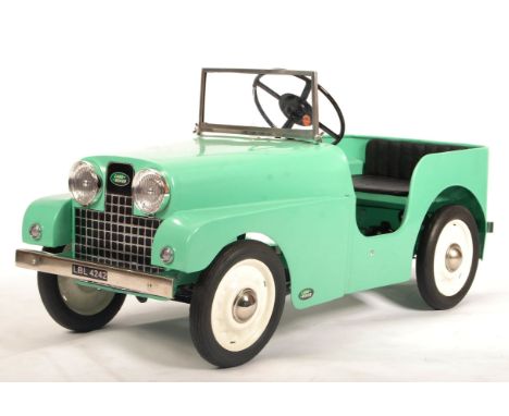 An incredible rare vintage 1950's Tri-ang / Triang made Land Rover Series 1 child's pedal car. Metal body, in Land Rover gree