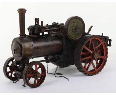 A live steam model of a Traction engine, 1930s, copper boiler, red painted spoked wheels, fittings include Bassett-Lowke pres