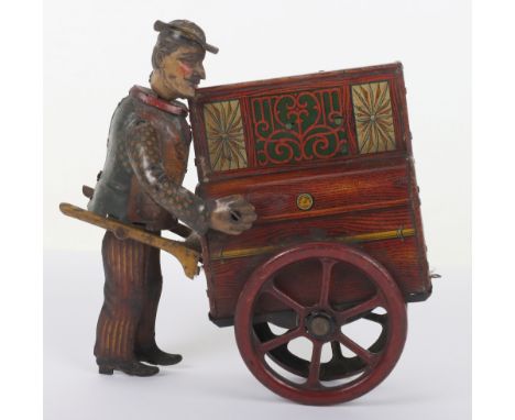 Distler Jacko the Merry Organ Grinder tinplate toy, lithographed organ grinder and brown decorated two-wheel organ with clock