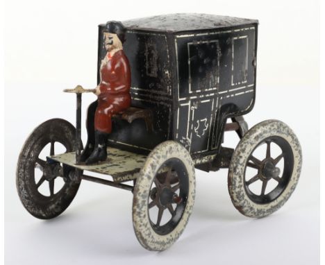 A Gunthermann tinplate clockwork cab, German circa 1900, black and white cab with silver detailing, hand painted seated drive
