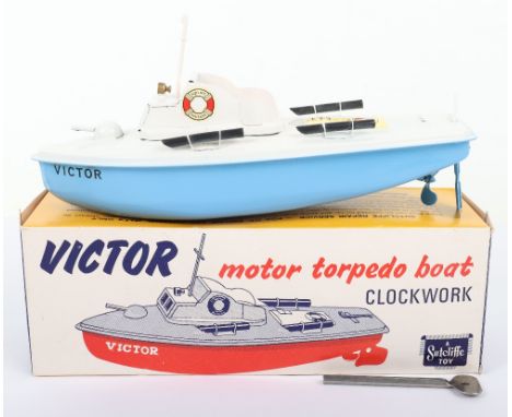 Sutcliffe ‘Victor’ Motor Torpedo Clockwork Tinplate Boat, light hull, white deck,  complete with decals, key and mast in pape