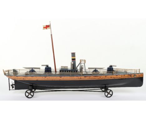A Bing tinplate clockwork Torpedo boat, German circa 1906, black and gold painted hull housing clockwork mechanism, grey deck