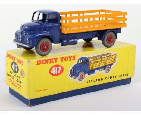 Dinky Toys 417 Leyland Comet Lorry, violet blue cab/chassis, dark yellow stake back, red ridged wheel hubs, in near mint orig