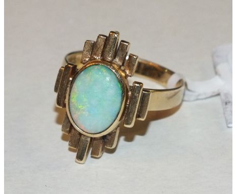 A contemporary 14k gold ring collet-set an oval opal, size P½, 6.8g.