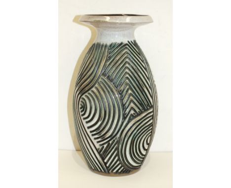 A Poole Pottery Atlantis vase by Jenny Haigh, of ovoid form with flared rim, the body with incised swirl and line decoration,