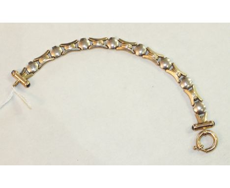 A 9ct white and yellow gold fancy-link bracelet with large bolt-ring clasp, 12.9g.