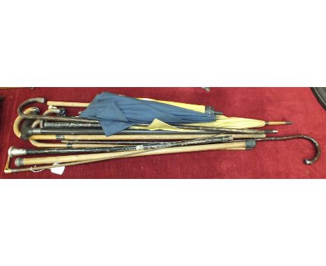 A lady's silver-mounted hunting crop with stag horn handle, a silver-mounted umbrella and various silver-mounted walking stic