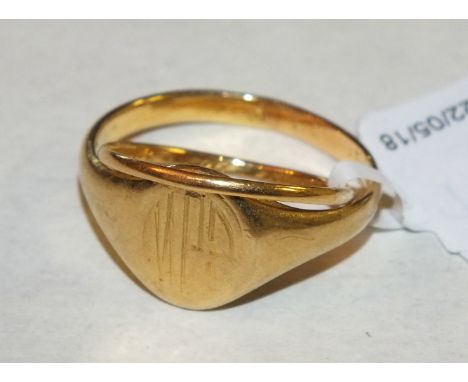 An 18ct gold signet ring, size X, 6g and a 22ct gold wedding band, 1g, both with inscriptions inside.