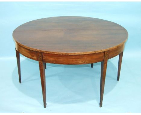 A Georgian mahogany gate-leg breakfast table, the circular fold-over top with inlaid shell motif, on square tapered legs, 138