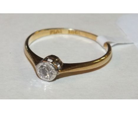 A solitaire diamond ring illusion-set an old brilliant-cut diamond, in 18ct gold and platinum mount, size J½, 1.3g.