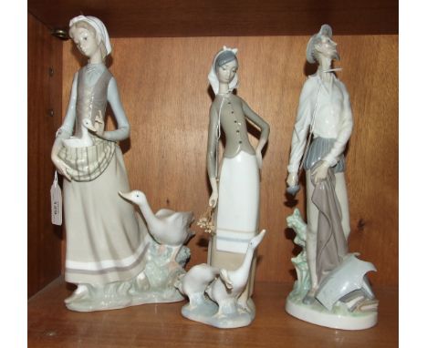 Three Lladro figurines, 'Young girl carrying a duckling within her apron, with larger duck beside her', 32cm high, 'Young gir